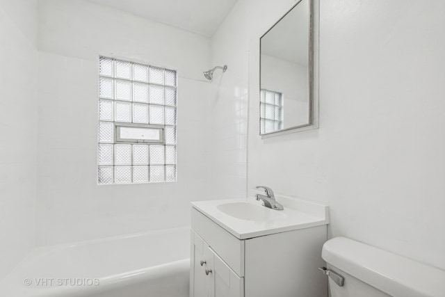 full bathroom featuring bathing tub / shower combination, vanity, and toilet