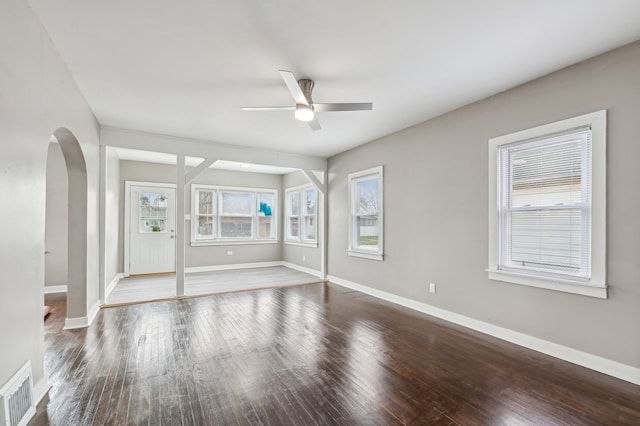 spare room with hardwood / wood-style flooring and ceiling fan