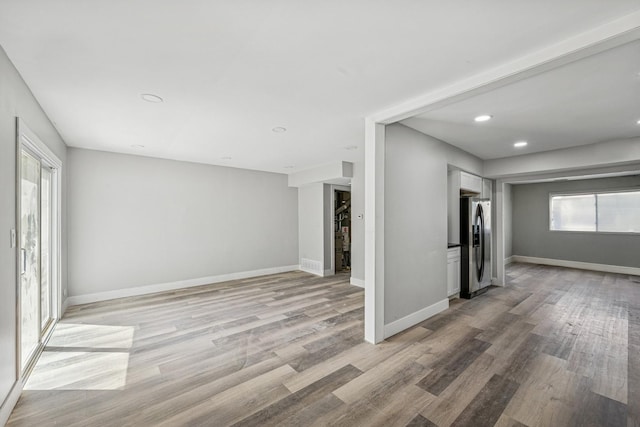 1130 Sandpiper Ct, Bartlett, IL 60103 - unfurnished living room featuring light wood-style floors, baseboards, and recessed lighting
