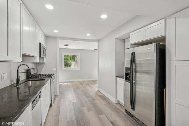1130 Sandpiper Ct, Bartlett, IL 60103 - kitchen with appliances with stainless steel finishes, a sink, light wood-style floors, white cabinetry, and recessed lighting