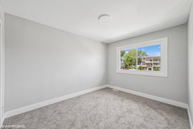 1130 Sandpiper Ct, Bartlett, IL 60103 - spare room featuring baseboards and carpet