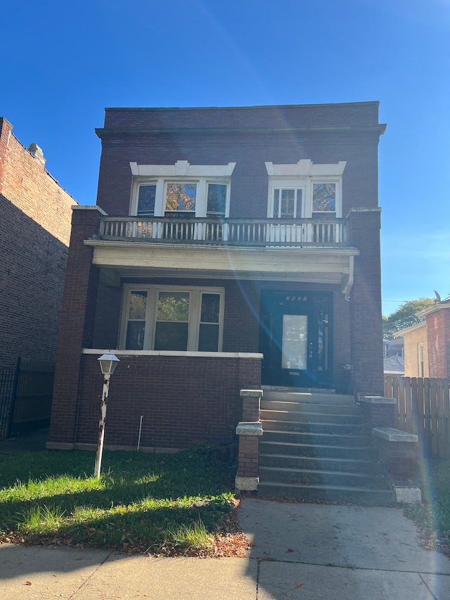 view of front of home with a balcony