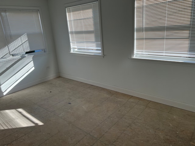 spare room featuring a wealth of natural light