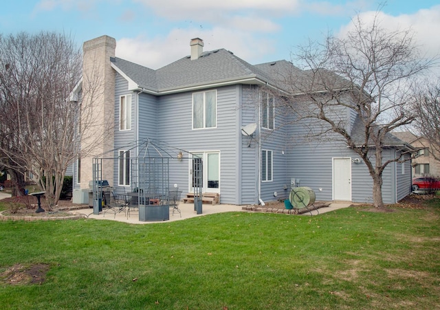 rear view of house with a lawn, a gazebo, and a patio area