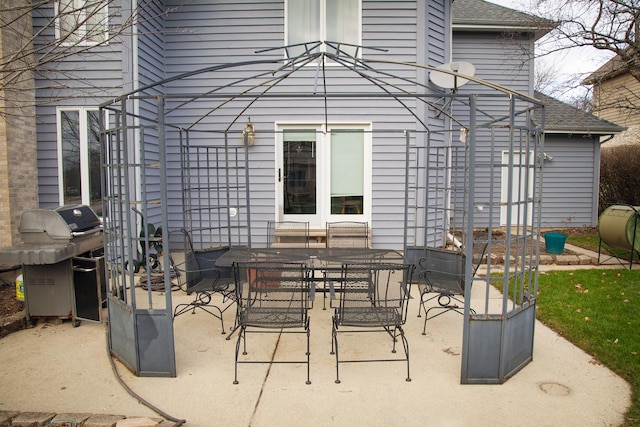 view of patio with a grill