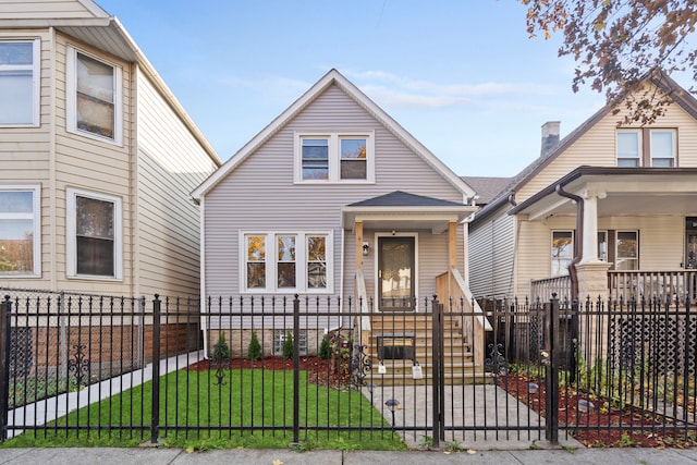 bungalow-style home with a front lawn