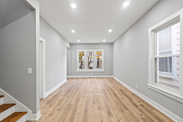 spare room featuring light wood-type flooring