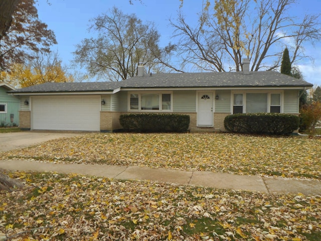 single story home with a garage