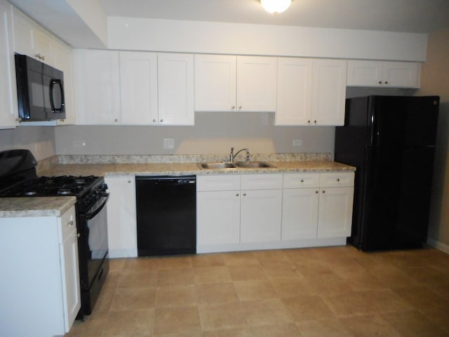 kitchen featuring white cabinetry, sink, and black appliances