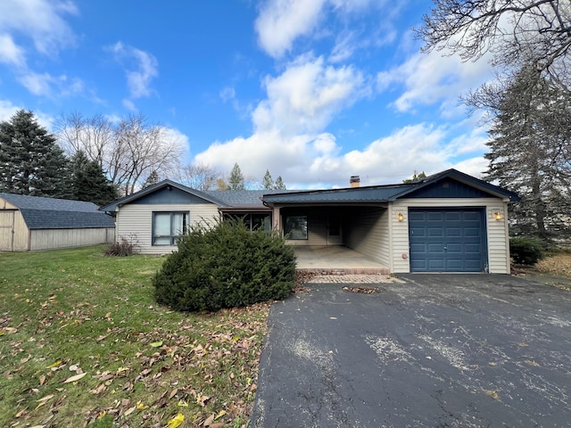 ranch-style home with a front lawn and a garage