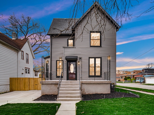 view of front of home with a lawn