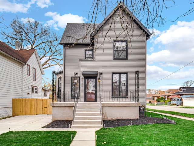 view of front of property with a front lawn