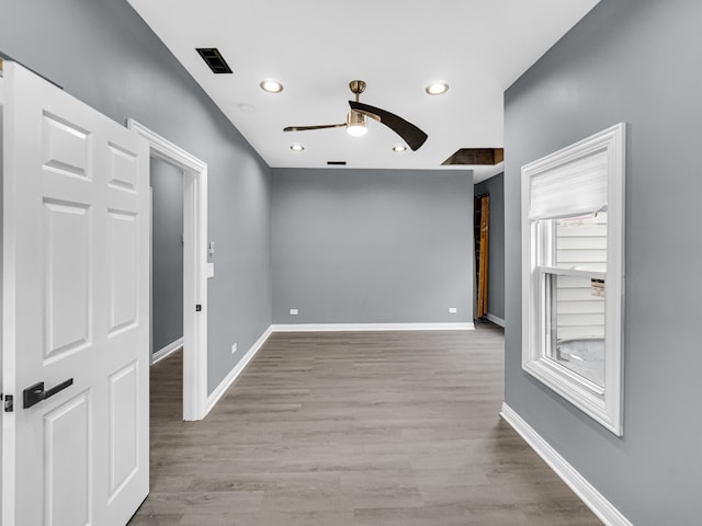 spare room with ceiling fan and light hardwood / wood-style floors