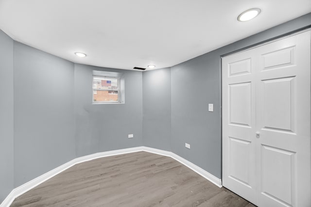 basement featuring hardwood / wood-style floors