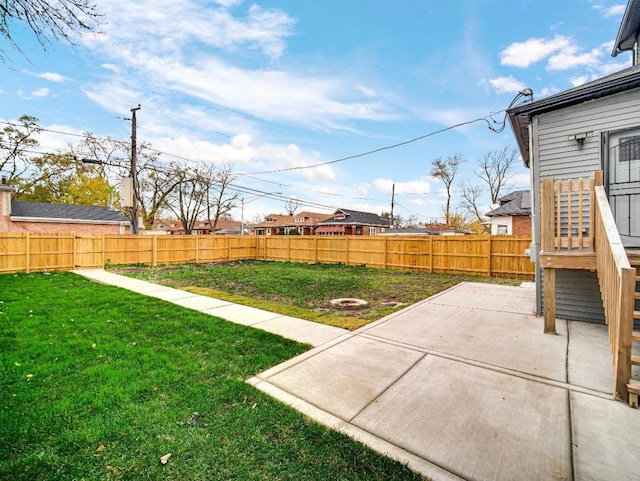 view of yard featuring a patio area and an outdoor fire pit