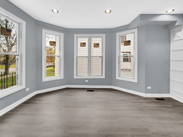 unfurnished dining area with hardwood / wood-style floors