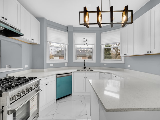 kitchen featuring sink, stainless steel appliances, light stone counters, decorative light fixtures, and white cabinets