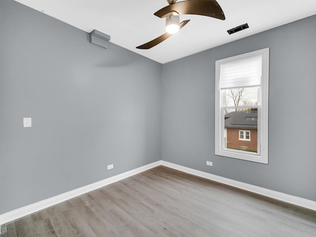 unfurnished room featuring ceiling fan and light hardwood / wood-style flooring