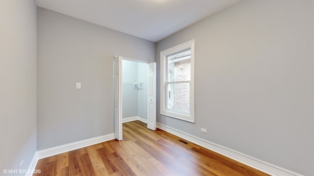 unfurnished room featuring light wood-type flooring