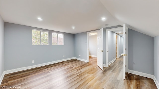 basement featuring light hardwood / wood-style floors