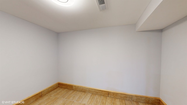 empty room featuring wood-type flooring