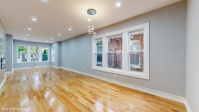 unfurnished room featuring light hardwood / wood-style flooring