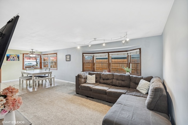 living room with ceiling fan and light carpet