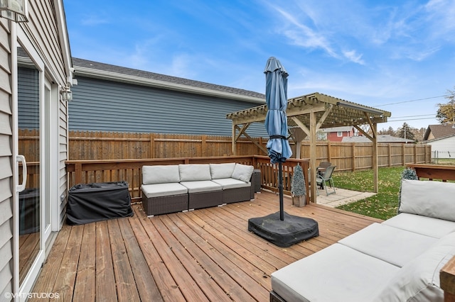 wooden terrace with outdoor lounge area and a patio area