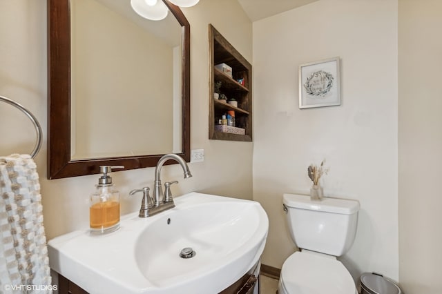 bathroom featuring toilet and sink