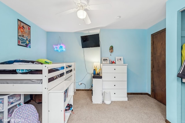 bedroom with light carpet and ceiling fan