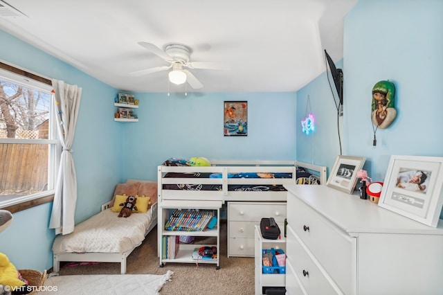 bedroom with light colored carpet and ceiling fan