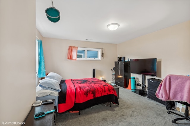 bedroom with multiple windows and carpet