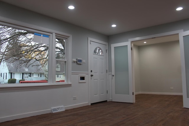 entrance foyer featuring dark hardwood / wood-style flooring