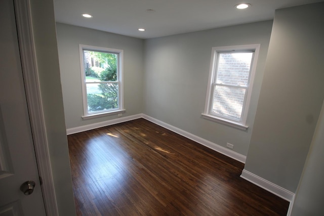 empty room featuring dark wood-type flooring