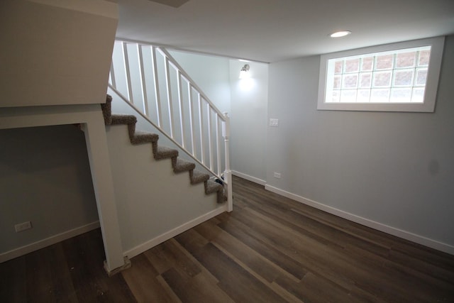 basement with dark wood-type flooring