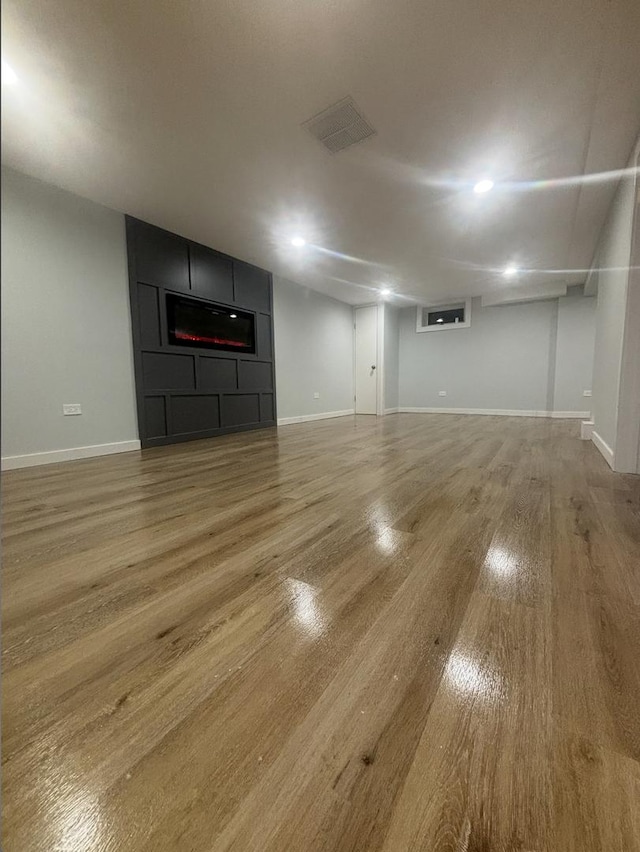 unfurnished living room featuring wood-type flooring