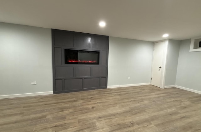 basement featuring dark wood-type flooring