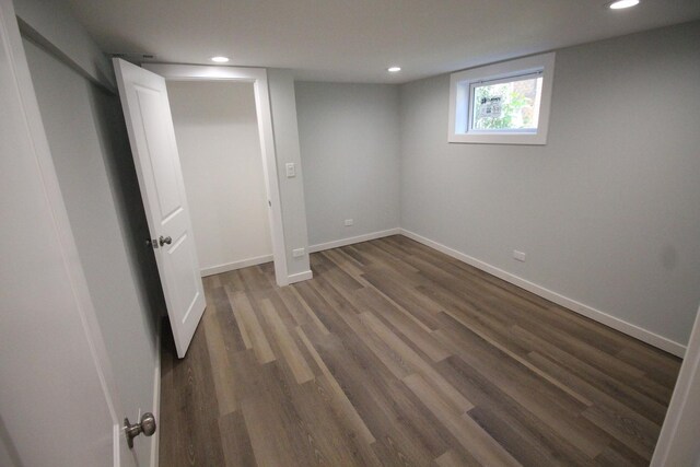 hallway with dark hardwood / wood-style floors