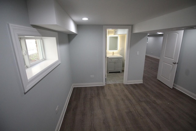 bathroom featuring a tile shower, tile patterned floors, vanity, and toilet