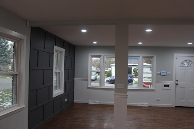 interior space with dark hardwood / wood-style flooring