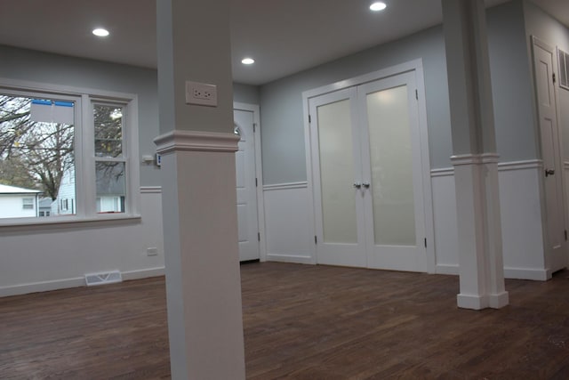 kitchen featuring white cabinets, dark hardwood / wood-style floors, appliances with stainless steel finishes, and tasteful backsplash