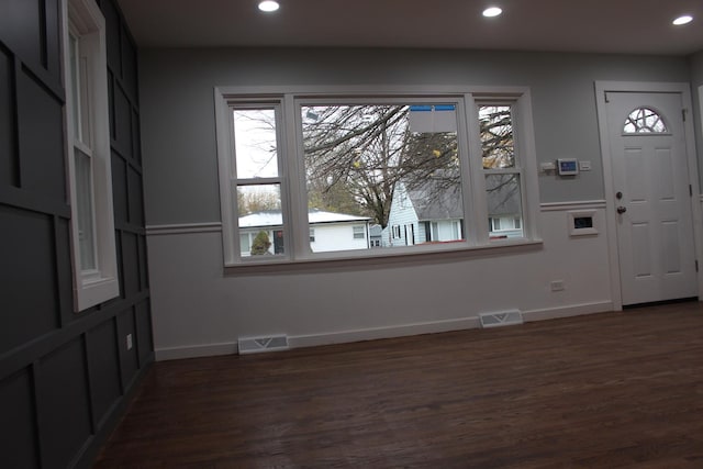 unfurnished room featuring dark hardwood / wood-style flooring