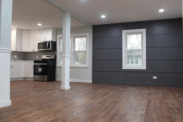 unfurnished living room featuring light hardwood / wood-style floors