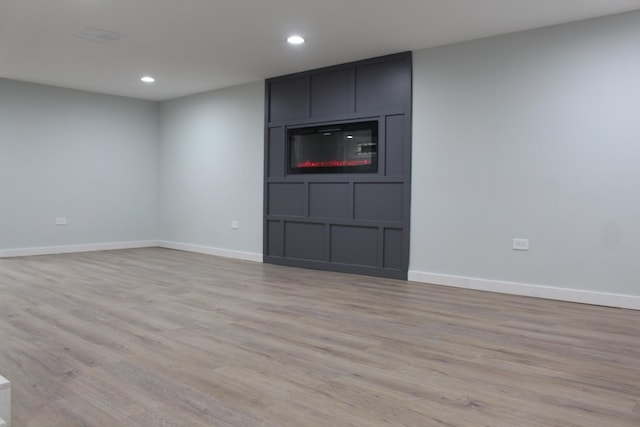 unfurnished living room featuring light hardwood / wood-style flooring