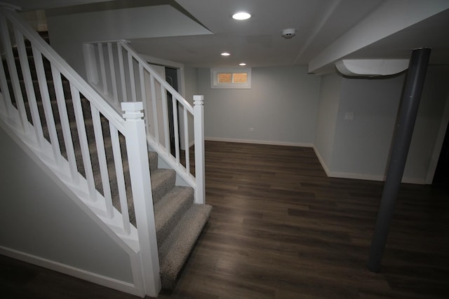 stairs featuring hardwood / wood-style floors