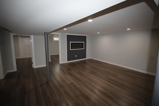 basement featuring dark hardwood / wood-style floors