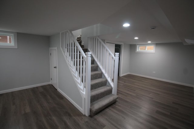 stairway with hardwood / wood-style floors