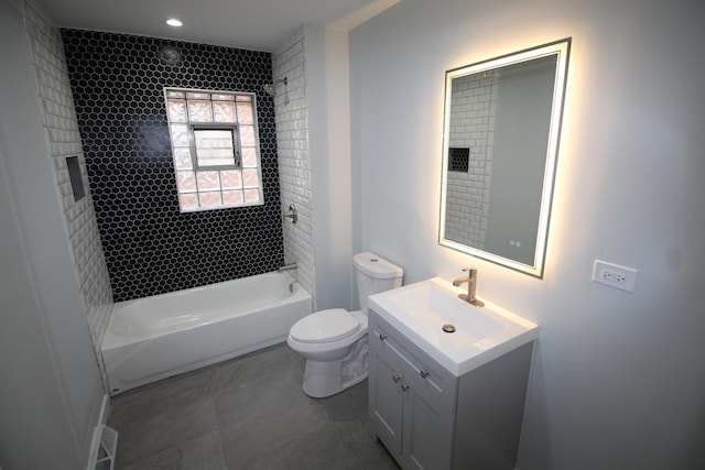 full bathroom featuring vanity, toilet, and tiled shower / bath