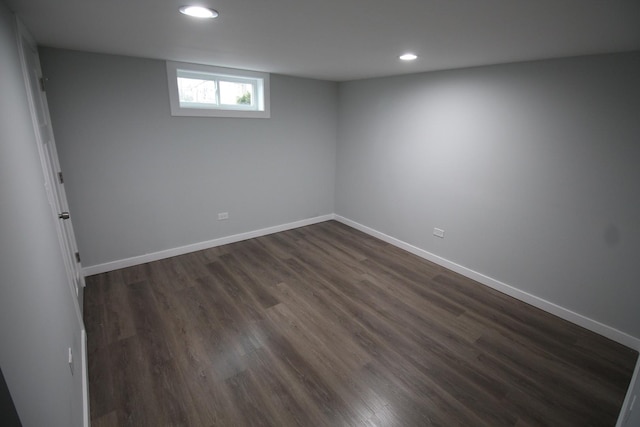 basement with dark wood-type flooring