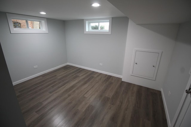 basement with dark hardwood / wood-style flooring